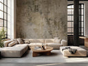Modern living room with a beige sectional sofa, round wooden coffee table, and textured beige wallpaper.