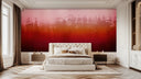 Bedroom with a dramatic pink-to-red gradient wallpaper behind a tufted headboard.