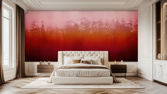 Bedroom with a dramatic pink-to-red gradient wallpaper behind a tufted headboard.