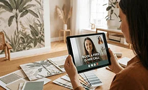 Person using a tablet in a home setting with plants and decor.